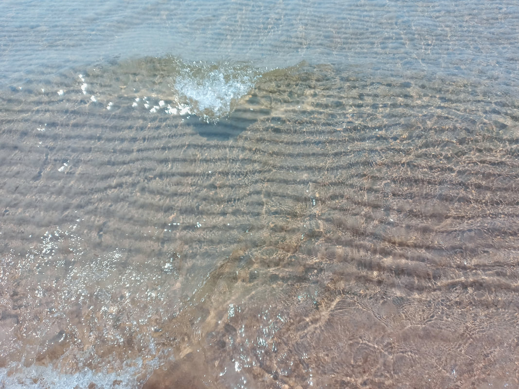 Crystal clear Lake Huron waters show the sand ripples