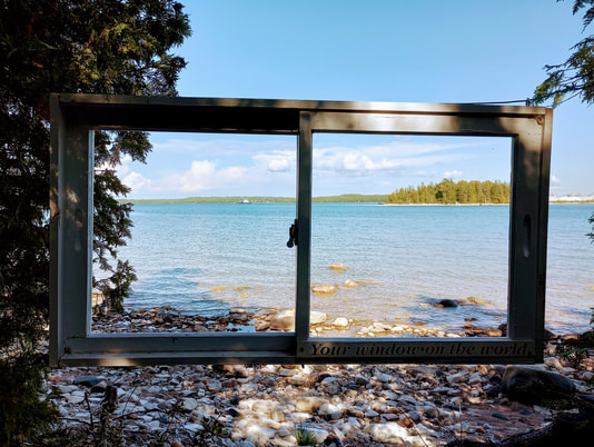 The Drummond Island Ferry is in the distance looking out this wonderful window to Lake Huron